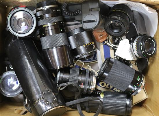 Four SLR cameras and various lenses, including Olympus OM10, OM2N and a Pentax P30T, etc